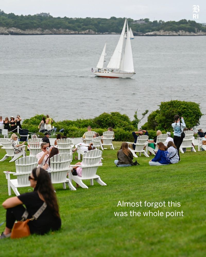 3: This is a photo of The Castle Hill Inn, a 40 acre estate  in Newport, RI offers views of the coastline and passing by sailboats from the outdoor seating area on July 11, 2025. The text on this slide reads: Almost forgot this was the whole point.