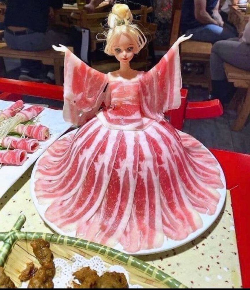A Barbie-like doll wears ham instead of clothes 