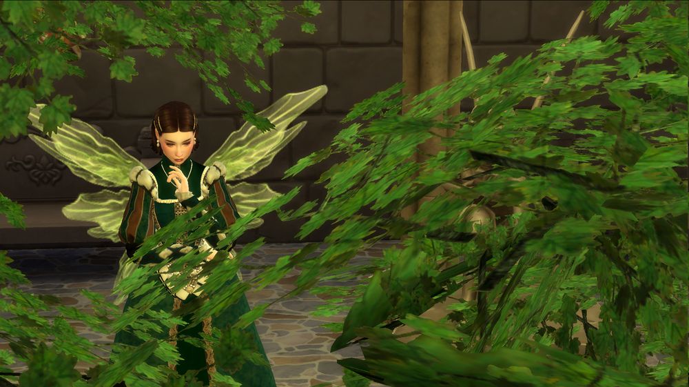 Screenshot from The Sims showing my character deep in their thoughts, surrounded by greenery.