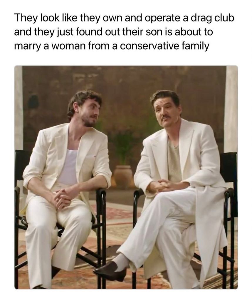 A photo of Paul Mescal and Pedro Pascal in casual white suits, with the caption: They look like they own and operate a drag club and they just found out their son is about to marry a woman from a conservative family.