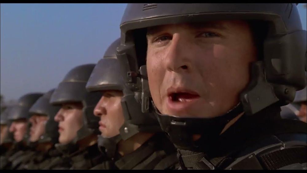 A military ad from Starship Troopers, where the soldiers break formation to turn to the camera and say, "I'm doing my part!"
