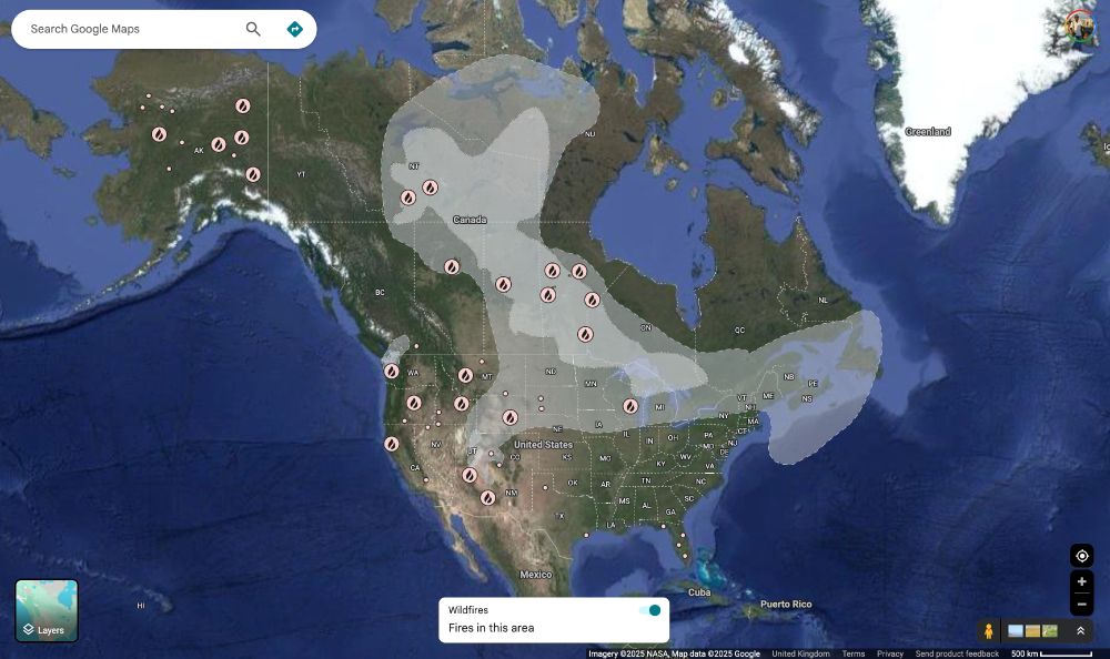 a Google map screenshot showing wildfires and smoke in North America