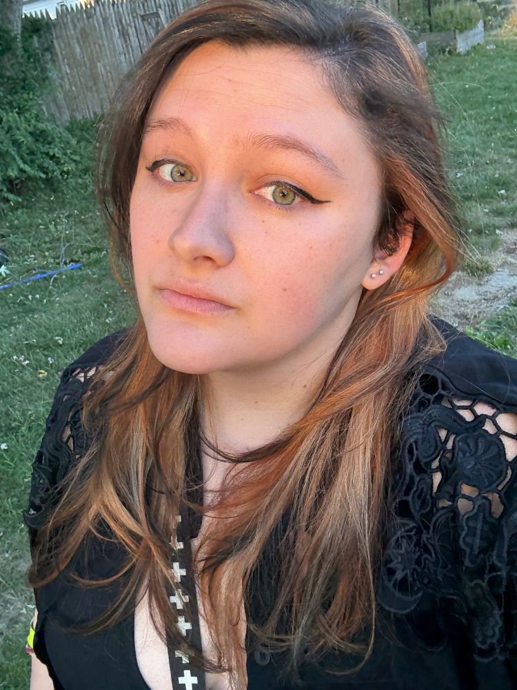 A selfie of me with a calico-style blend of fox orange, blonde, and my dark hair with black tips