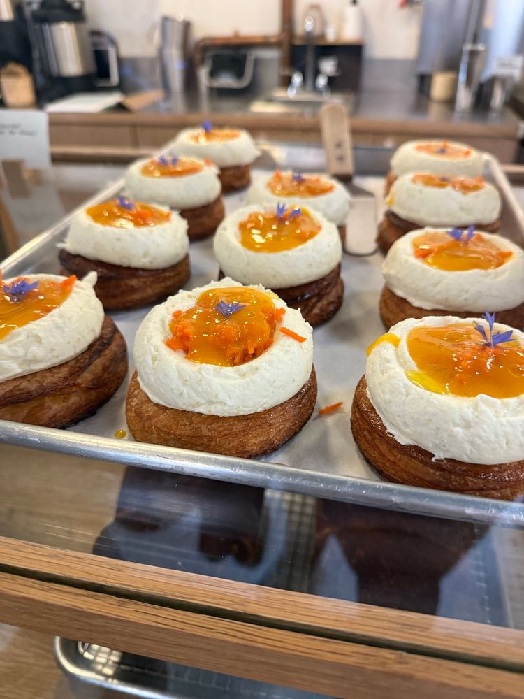 Beautiful selection of laminated pastry circles topped with whipped Marscapone cheese and a citrus curd with shaved carrots 