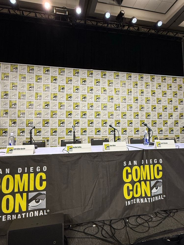 Seth Allyn Austin, Keythe Farley, Zeke Alton and Sarah Elmaleh’s name plates set up on a table for San Diego Comic-Con panel.
