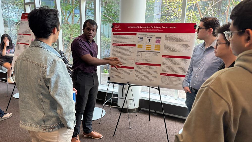 Photo of a Carnegie Mellon University Privacy Engineering student sharing their research at a poster session