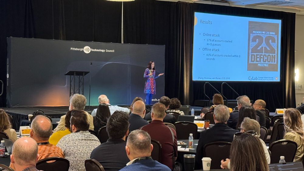 Photo of Lorrie Cranor giving the keynote presentation at Cyburgh 2025