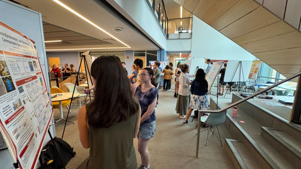 Photo of Carnegie Mellon REUSE students presenting their research during the REUSE poster session