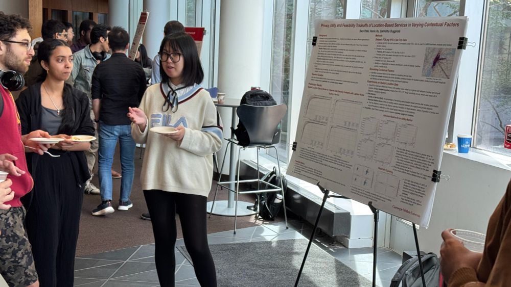 Photo of a Carnegie Mellon University Privacy Engineering student sharing their research at a poster session