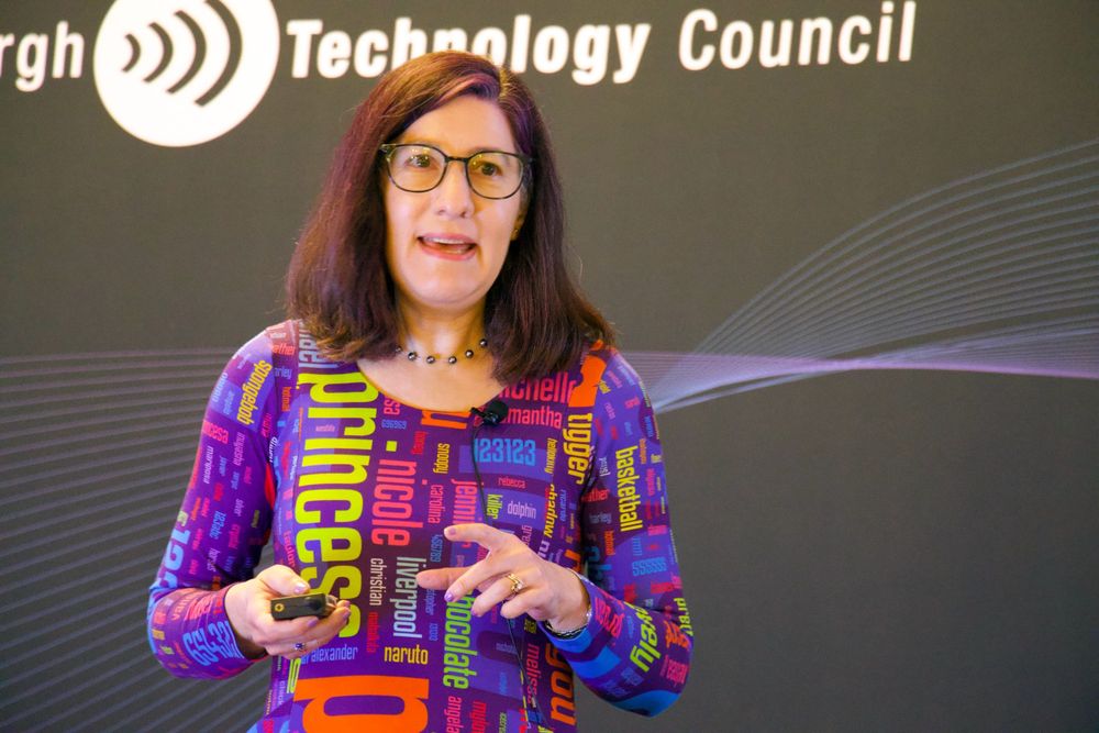 Photo of Lorrie Cranor giving the keynote presentation at Cyburgh 2025