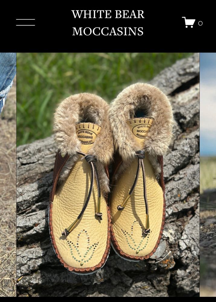 Beautiful fur lined moccasins with a flower on the
