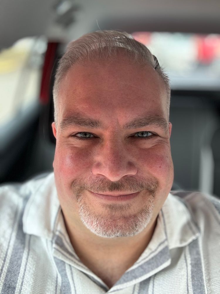 Selfie of a middle-aged white man in a car