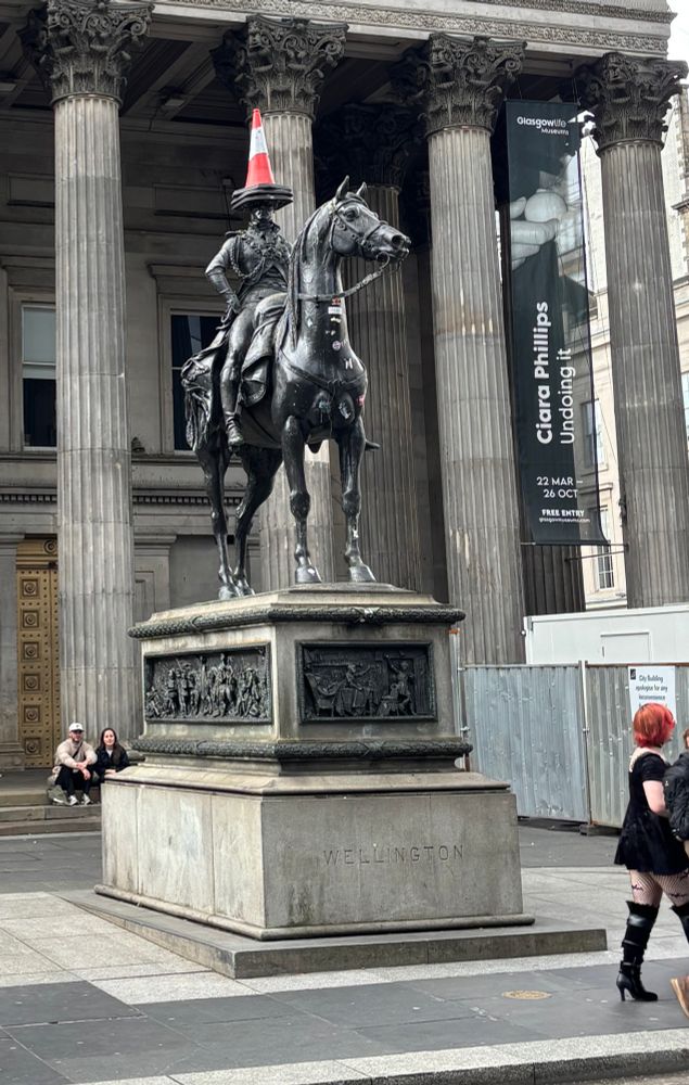 Photo of the statue of the Duke of Wellington in Glasgow, Scotland, with a traffic cone on his head