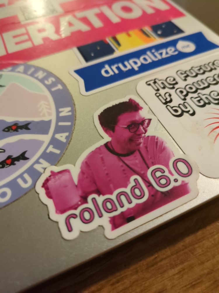 A photo of stickers on a laptop case. 