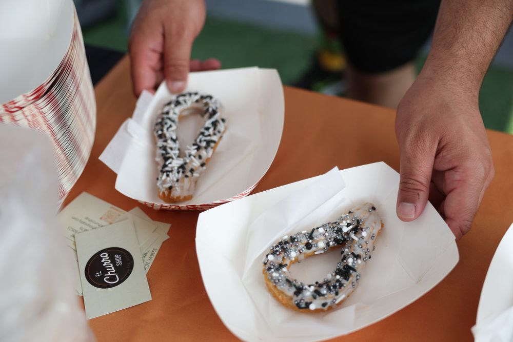 Churros decorated in White Sox colors are handed out in a parking lot before a White Sox-Royals game on Mexican Heritage Night at Rate Field on June 6, 2025, in Chicago. (John J. Kim/Chicago Tribune)
