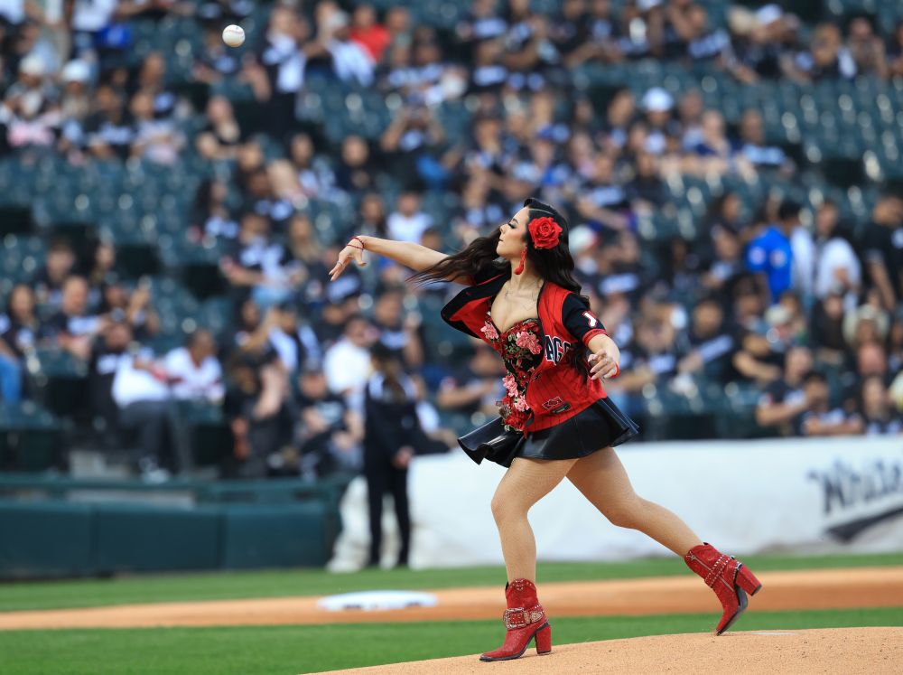 After performing the national anthem, Angelina Victoria throws out the ceremonial first pitch for a White Sox-Royals game on Mexican Heritage Night at Rate Field on June 6, 2025, in Chicago. (John J. Kim/Chicago Tribune)
