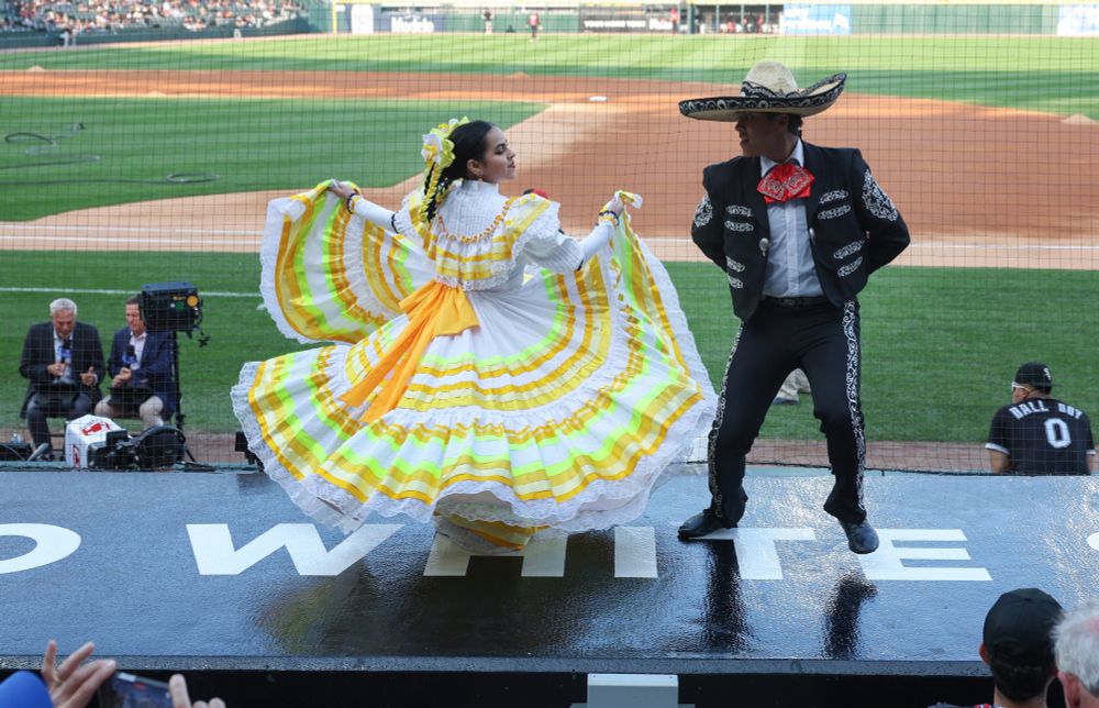 Members of Ballet Folklorico de Chicago perform above the dugout before a White Sox-Royals game on Mexican Heritage Night at Rate Field on June 6, 2025, in Chicago. (John J. Kim/Chicago Tribune)

