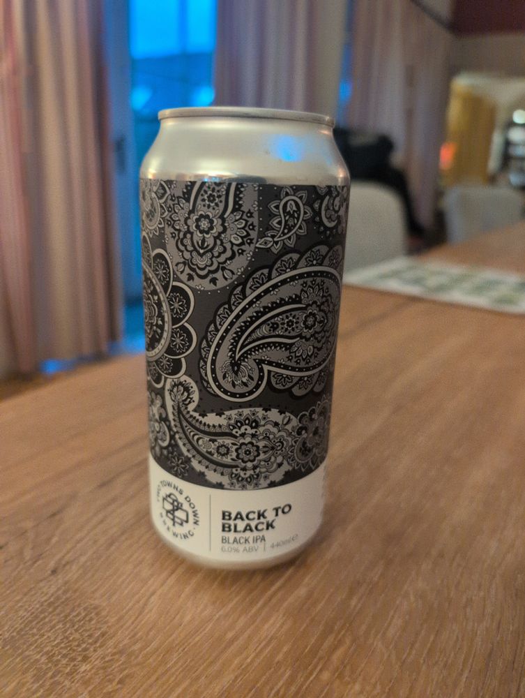 A paisley patterned can of Back to black IPA from two towns down brewing.