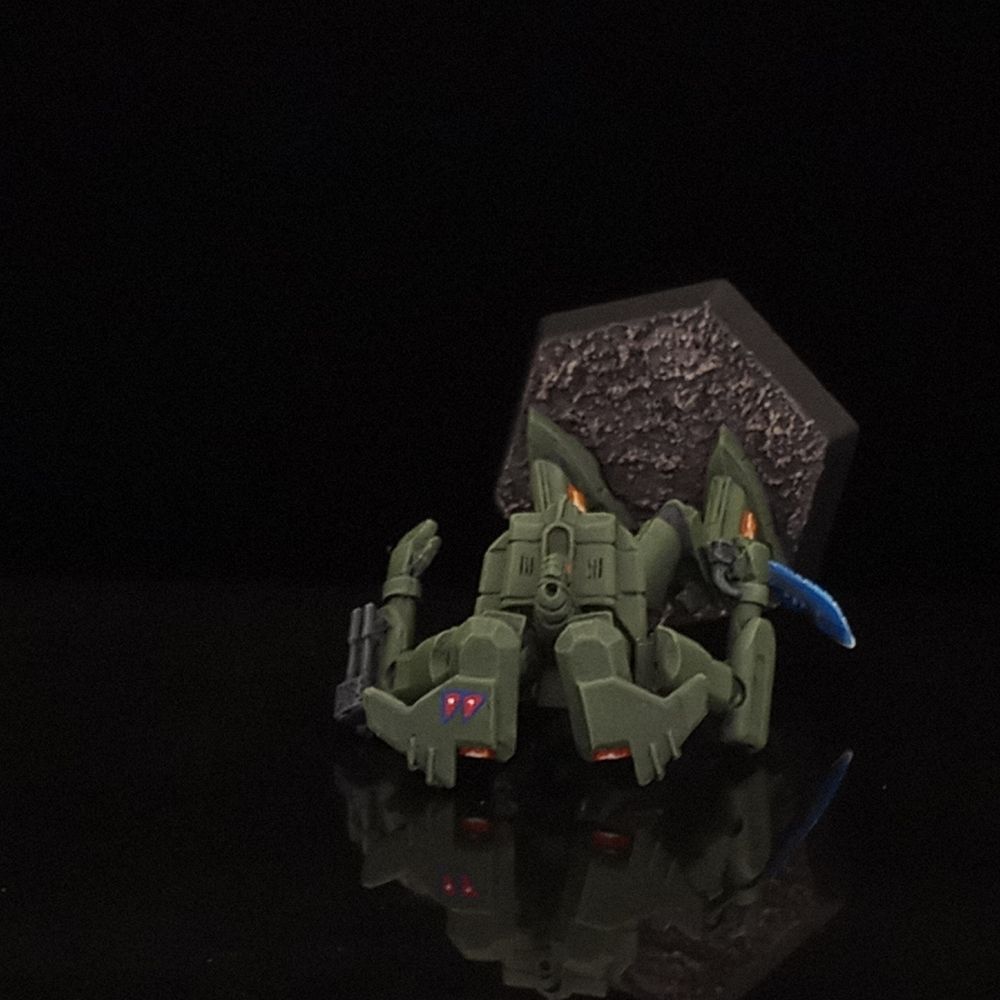 A top view of the Dola, showing off its base and a Nepali flag painted atop one of its jet verniers.