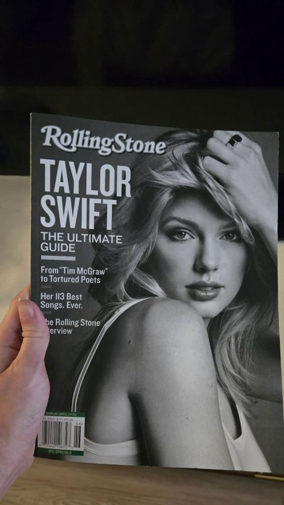 Me holding a copy of Rolling Stone Magazine's "Taylor Swift The Ultimate Guide"