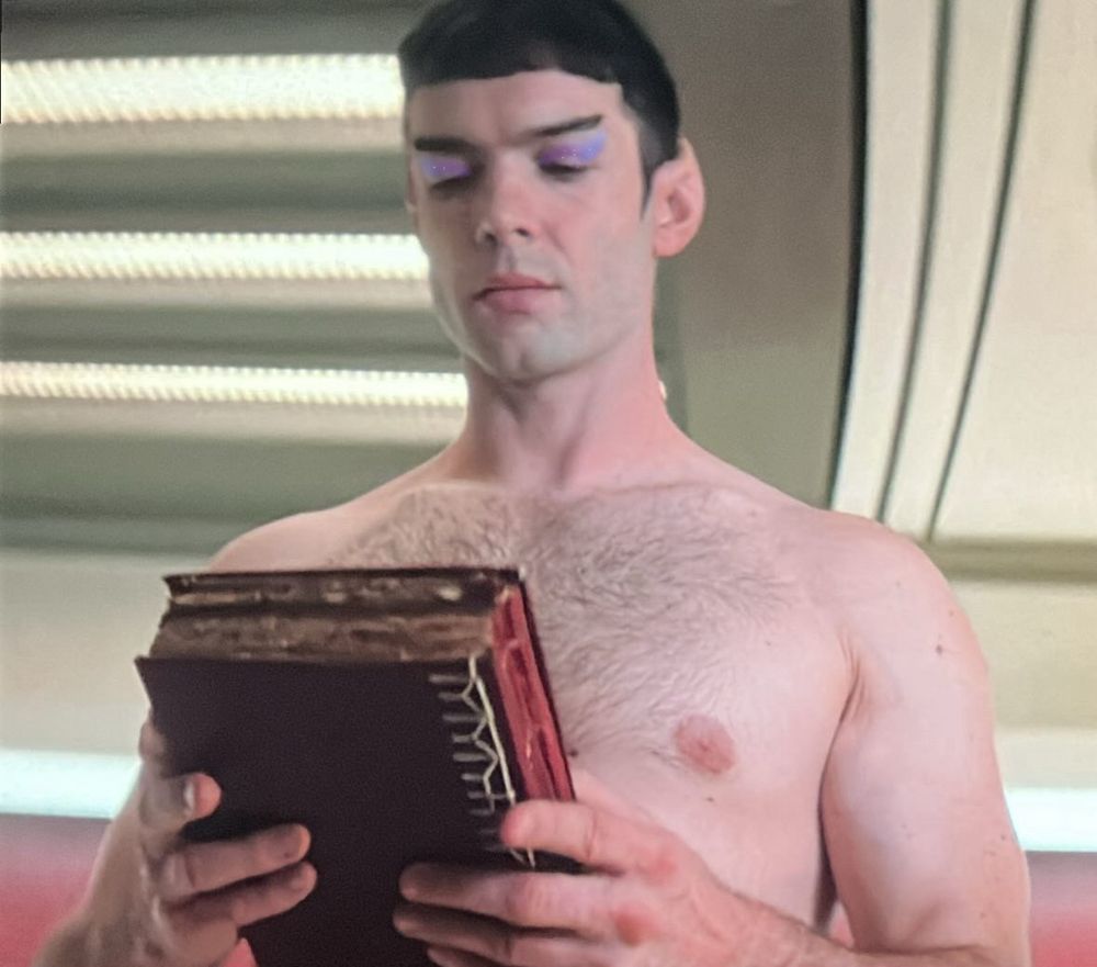 Ethan peck spock w/o a shirt with lavender and pale blue eyeshadow 