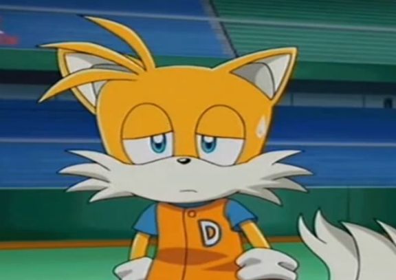 Miles “Tails” Prower in a baseball jersey, looking forlorn and frustrated out on a baseball stadium field