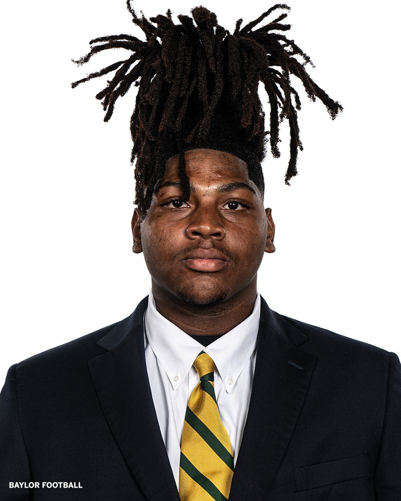 Portrait of Baylor football player Alex Foster in uniform. The 18-year-old defensive lineman, originally from Mississippi, passed away unexpectedly while home.