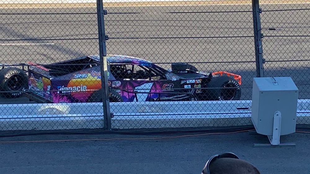 A close-up of Burt Myers’ beach-themed tour-type modified stopped on the frontstretch during an early red flag.