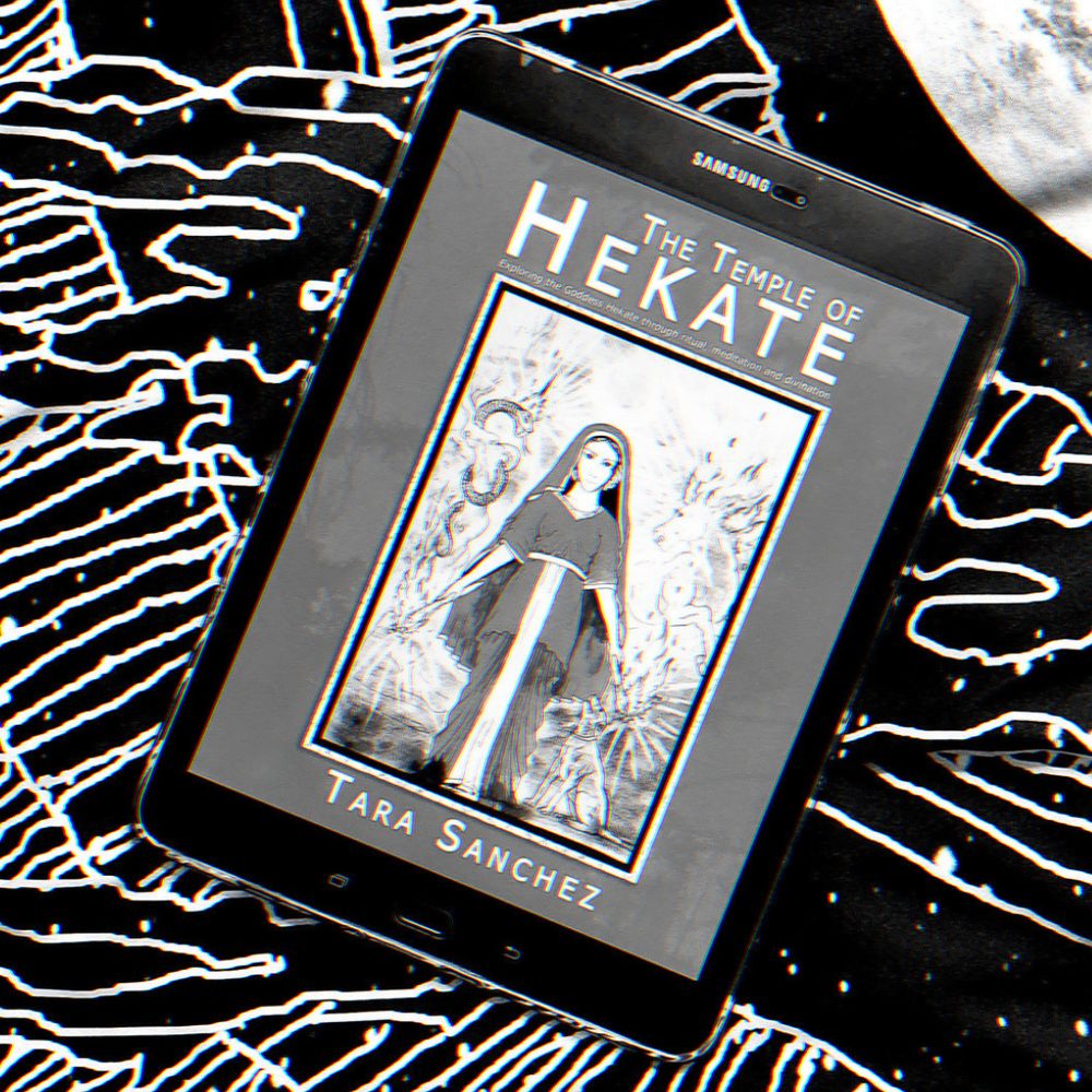 A black and white photo of Tara Sanchez's book THE TEMPLE OF HEKATE, displayed on a tablet.