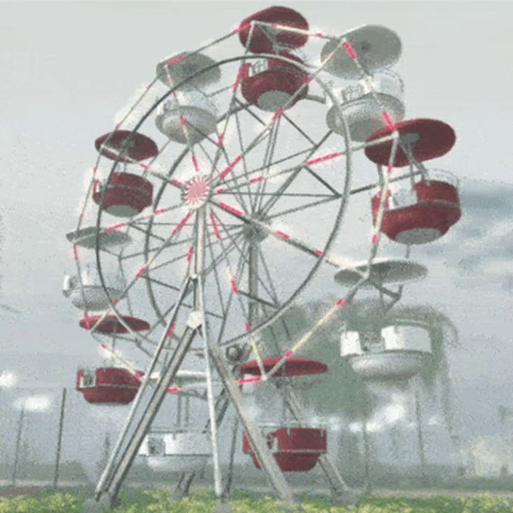 a ferris wheel with red and white gondolas going around it