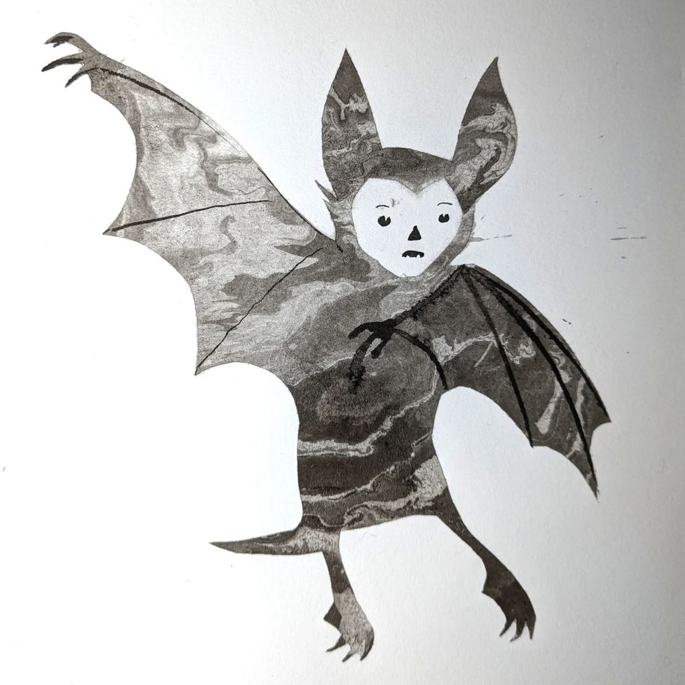 A suminagashi stencil print of a bat-like creature 
