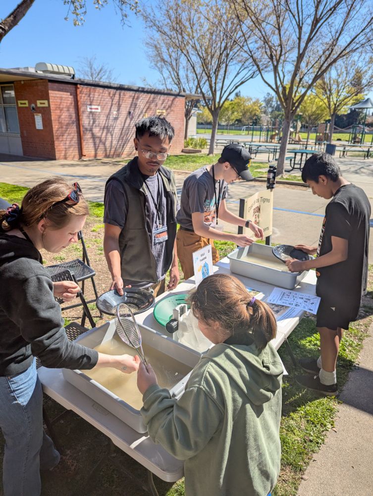 Sac State undergrad students teaching about gold panning.