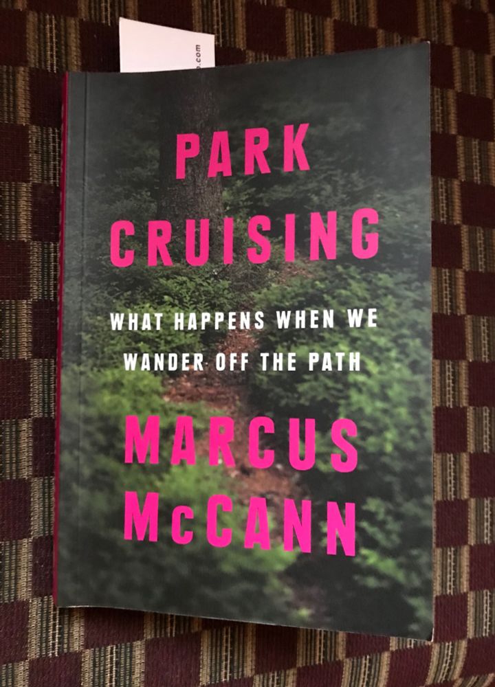 Book cover. Title is Park Cruising What Happens When We Wander Off the Path. Author: Marcus McCann. Background is a shot of a green space
