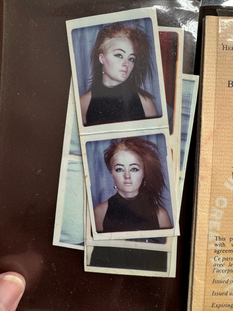 Punky looking girl with dark red hair - the shaved sides are blonde. Photo taken in an old Photo Booth.
