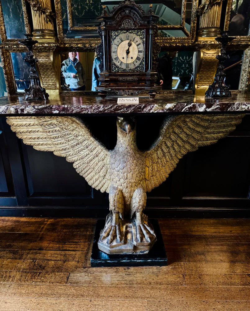 Eagle statue supports a table. Very fancy.