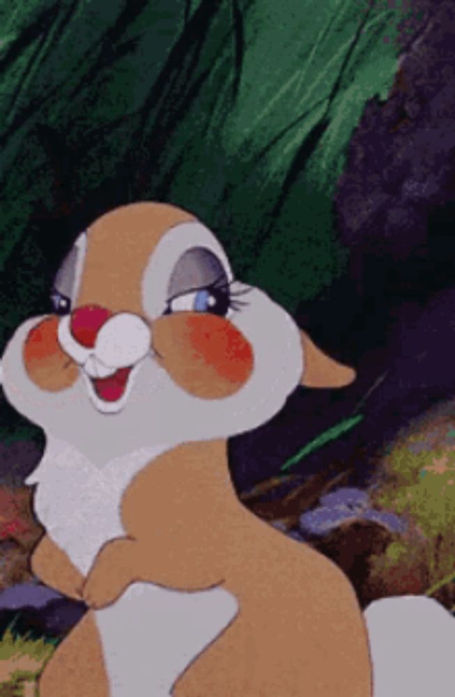 a close up of a cartoon bunny with a big smile on its face .