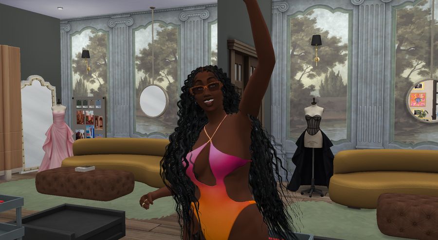 valerie locklear in a pink and orange ombre one piece swimsuit, plus leopard print shades, and long boho braids, standing in indya's at home styling studio, taking a photo