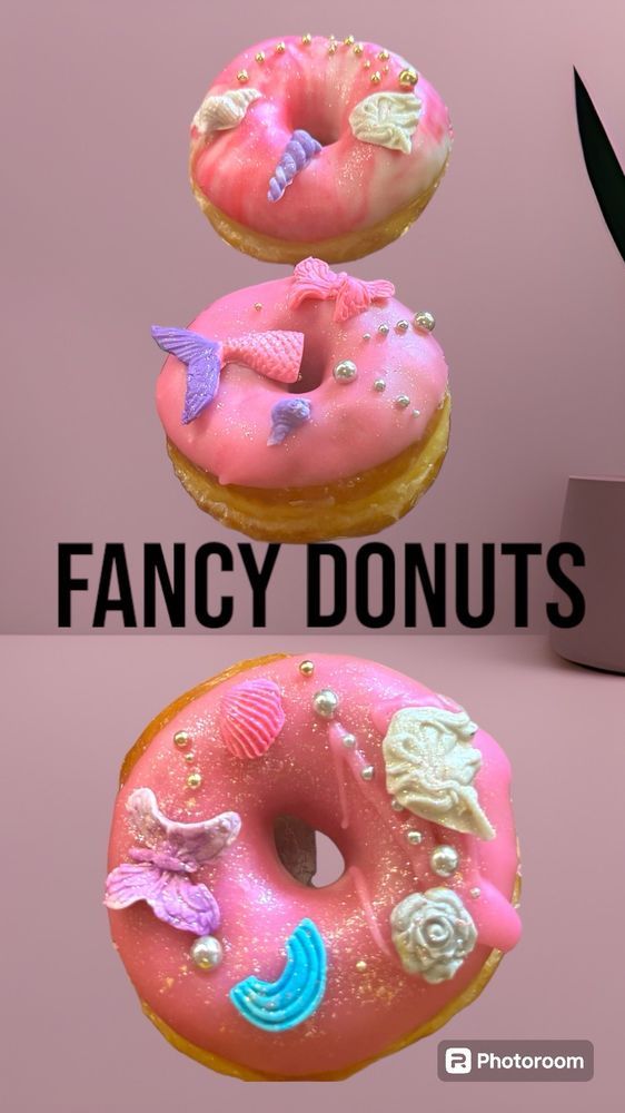 Poster of three raised, pink glazed donuts with very dubious sugar decorations.