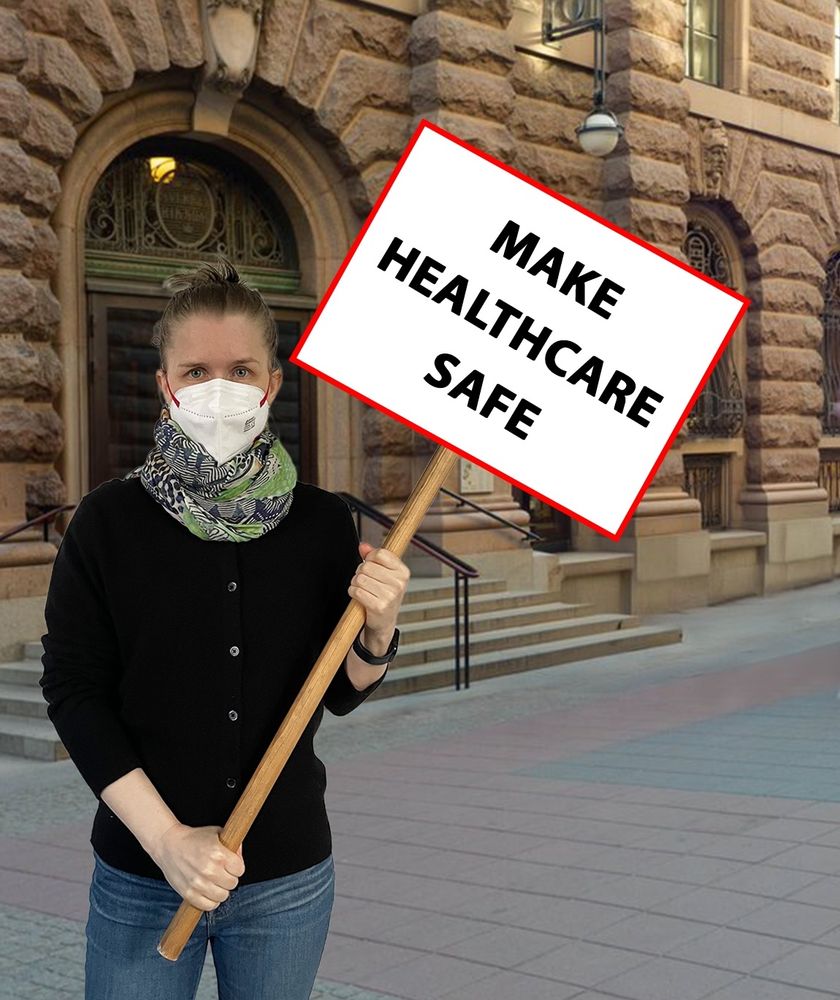 A photoshopped image of me standing outside the Swedish parliament, wearing a respirator and holding a sign saying ”MAKE HEALTHCARE SAFE”.
