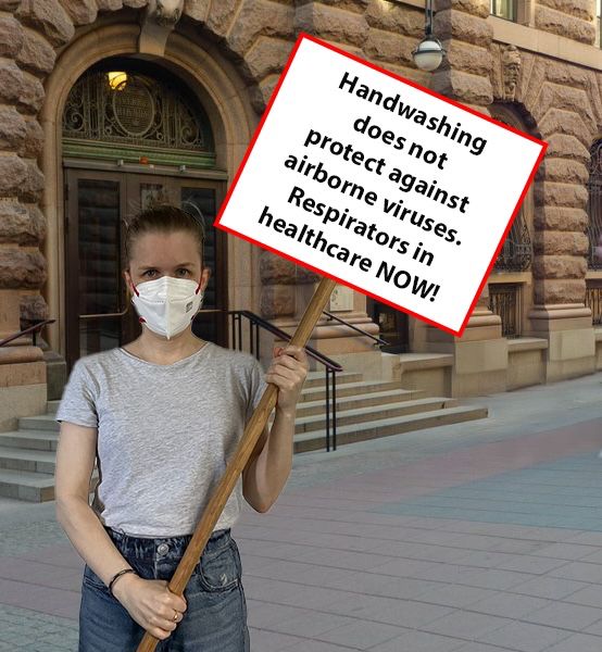 A photoshopped image of me standing outside the Swedish parliament, wearing a respirator and holding a sign saying ”Handwashing does not protect against airborne viruses. Respirators in healthcare NOW!”.