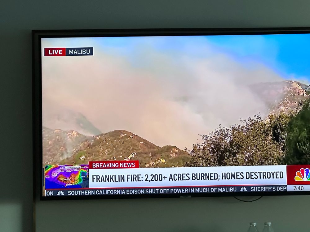 A photo of a tv with a local LA NBC news station covering wildfires burning in Malibu. 