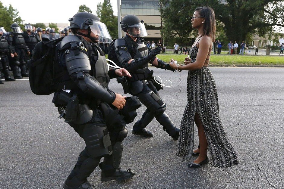 One woman peacefully confronts -- and awes -- police in riot gear