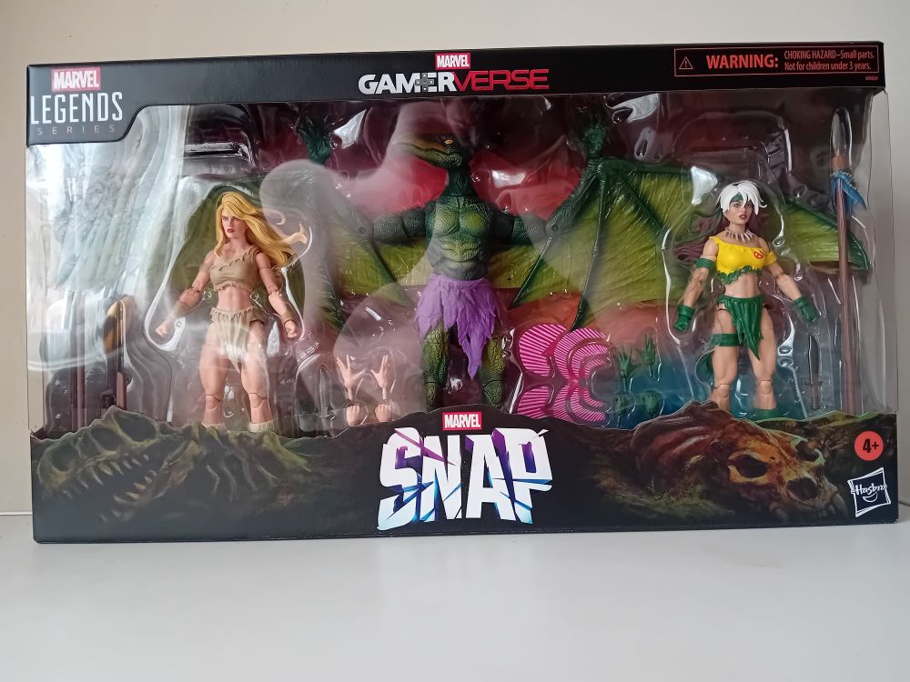 Marvel Legends Gamerverse: Marvel Snap Savage Land 3 pack - front of box showing the three figures (Shanna, Sauron and Rogue) with accessories 