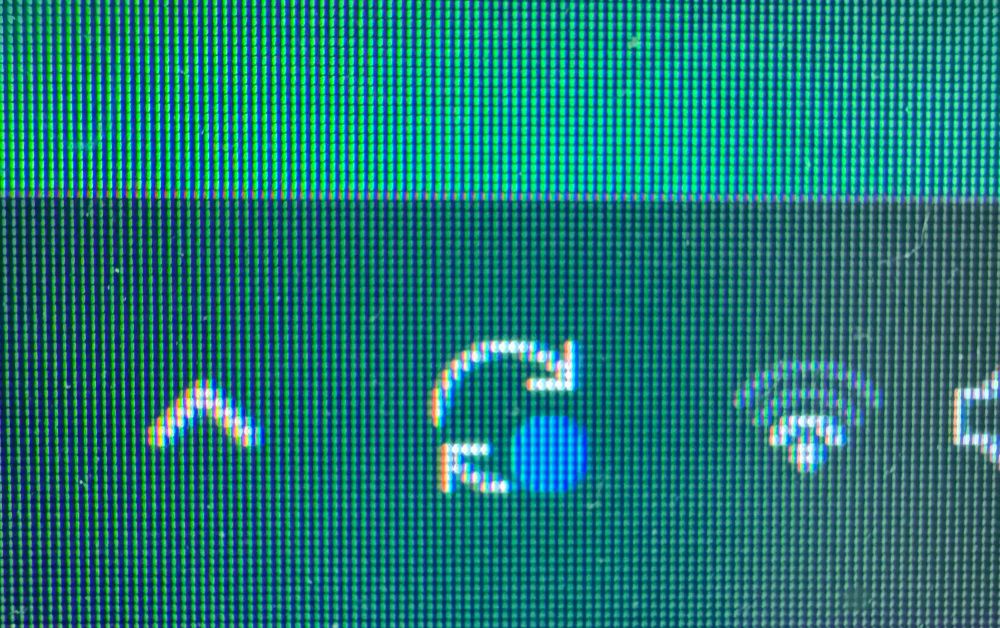 Close up photo of the system update alert icon from my computer 