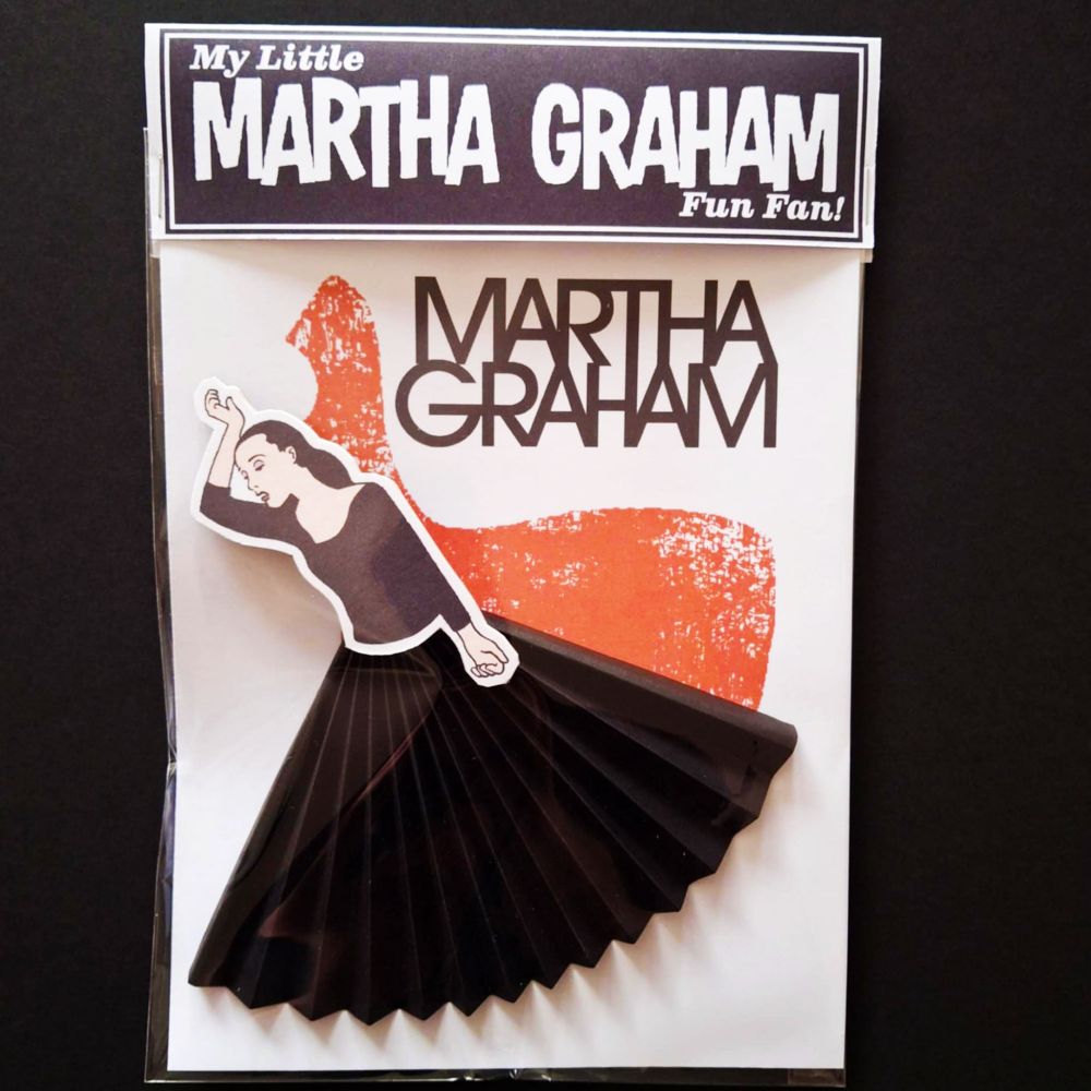 The martha graham paper fan in it's packaging.