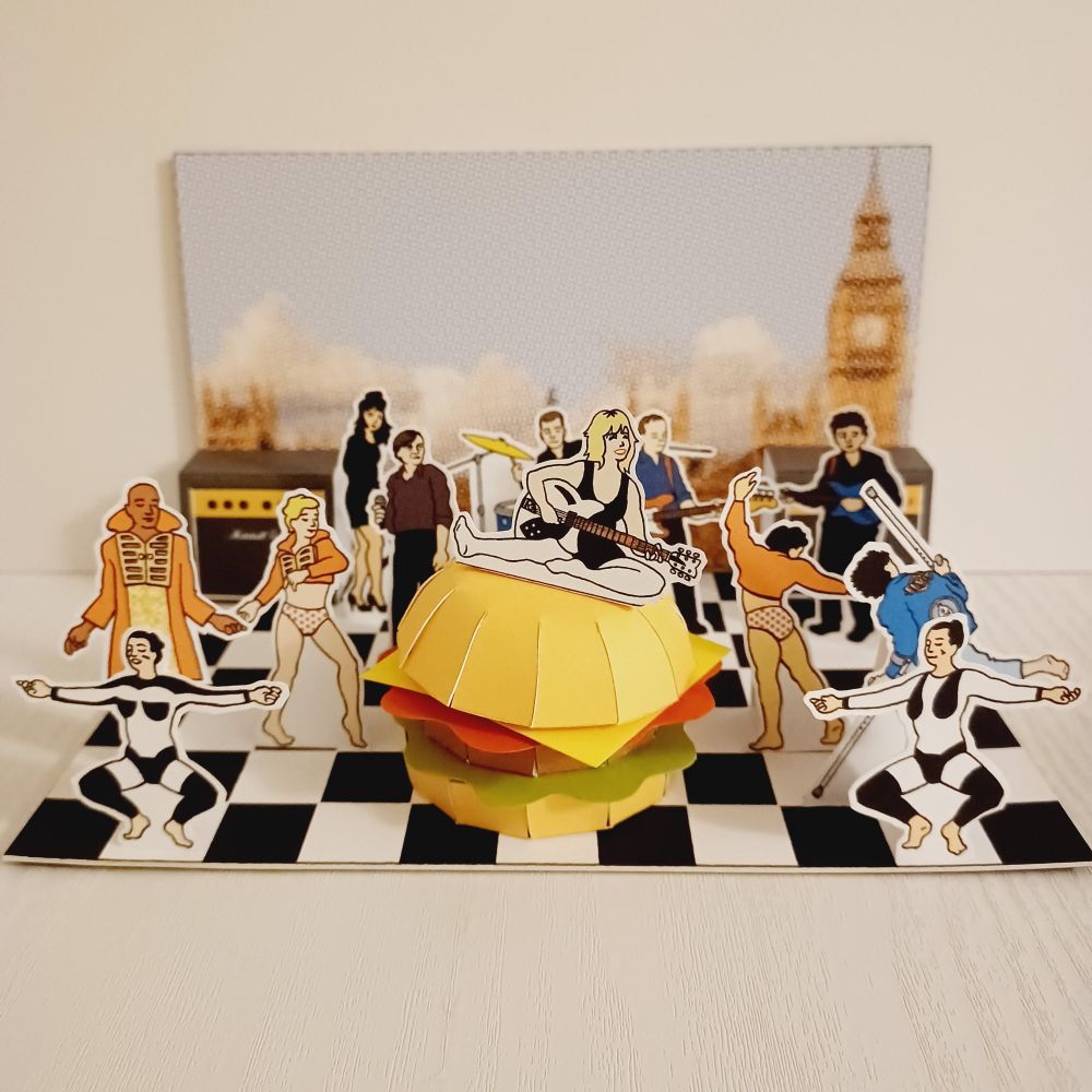 A cardboard and paper diorama depicting pop group sensation The Fall and noted hoofers The Michael Clark Dance Co. performing their legendary 'I am Curious Orange' piece.