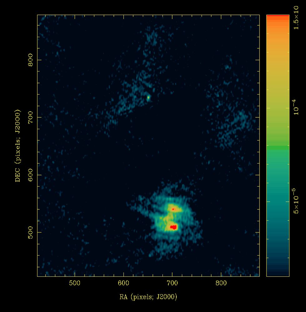 Colourful radio image containing an extended fuzzy blob near the bottom and a faint point near the upper-middle. 