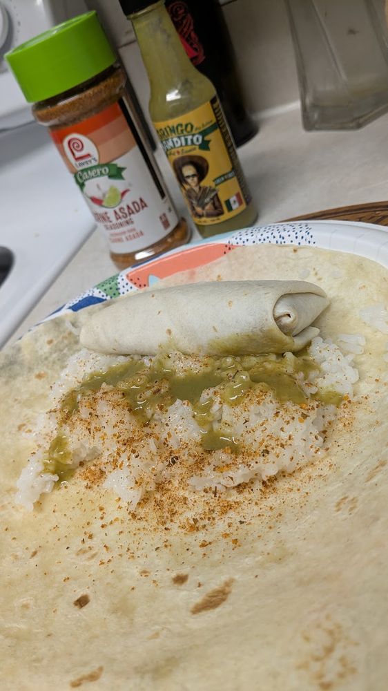 a double wrapped burrito using rice, seasoning, green habanero sauce, and a (cooked) frozen bean and cheese burrito.