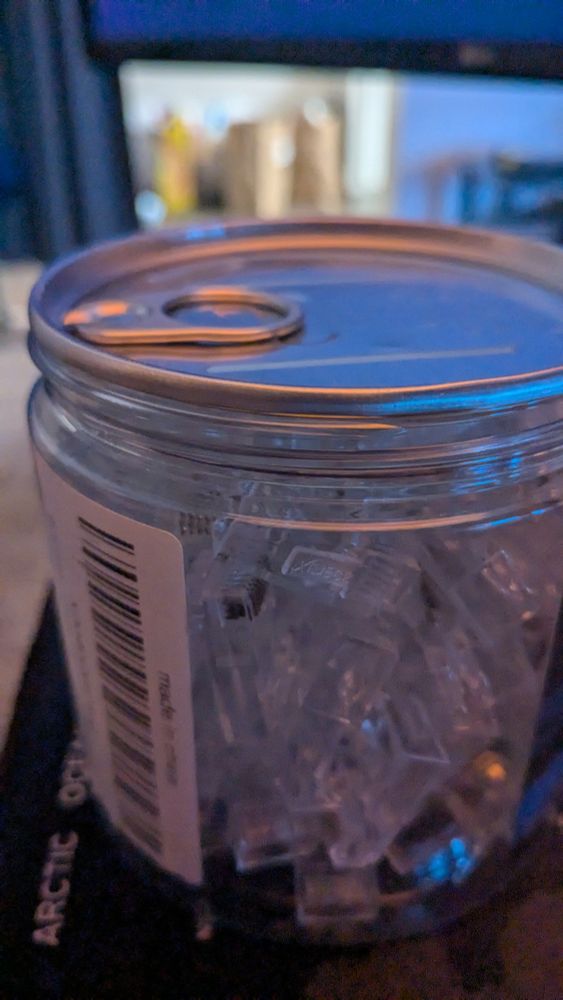 unopened tennisball-style can of RJ-45 connectors