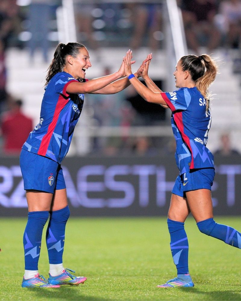Kaleigh Kurtz and Ashley Sanchez celebrate after KK's goal